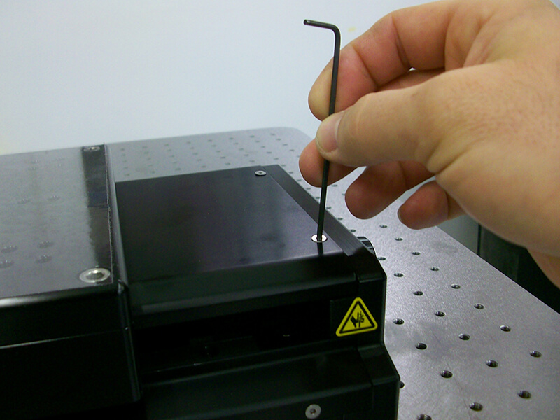 Removing the cover off a linear stage to perform maintenance